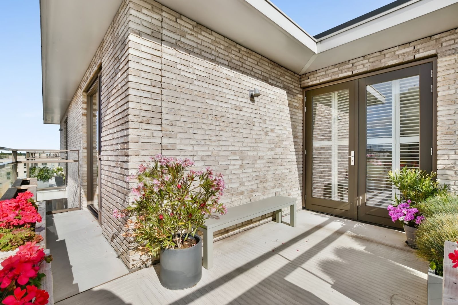 Modern veranda with expert masonry and neatly arranged potted plants
