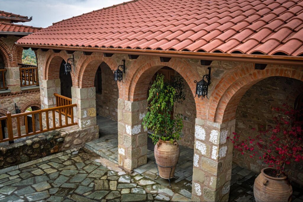 Decorative courtyard with mixed masonry tiling and planters.